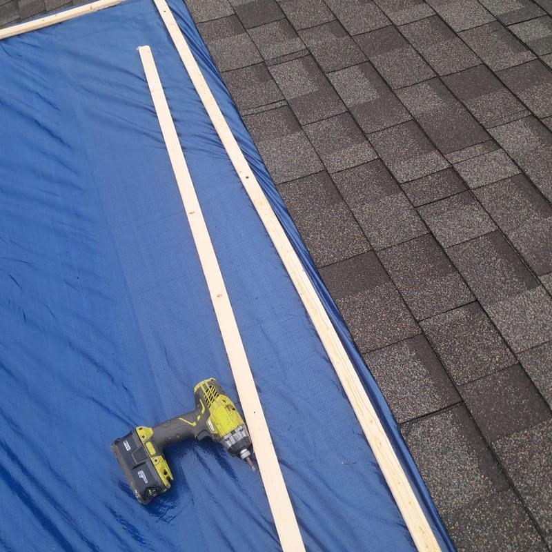 Roof tarp installation on shingled roof with drill Roof tarp installation on shingled roof with drill