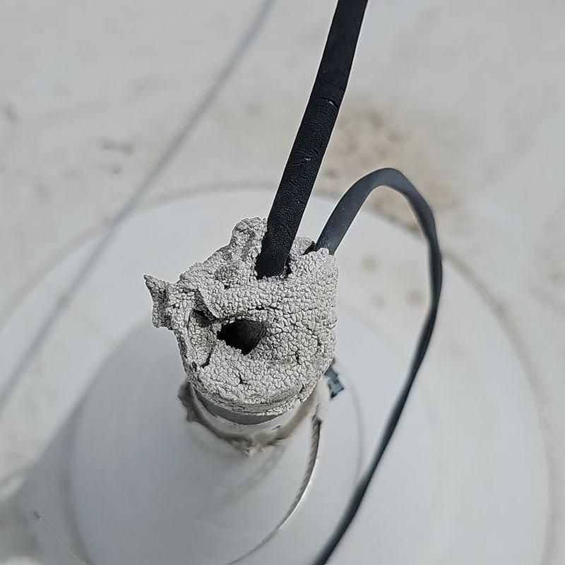 TPO flat roof pipe jack with cracked sealant and wires TPO flat roof pipe jack with cracked sealant and wires
