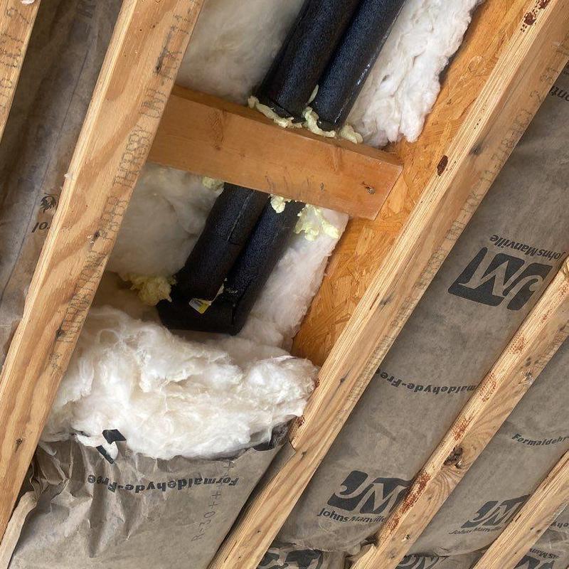 Ceiling insulation and vapor barrier installation in garage framing