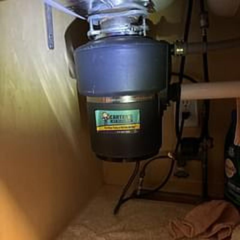 Garbage disposer under sink with plumbing connections