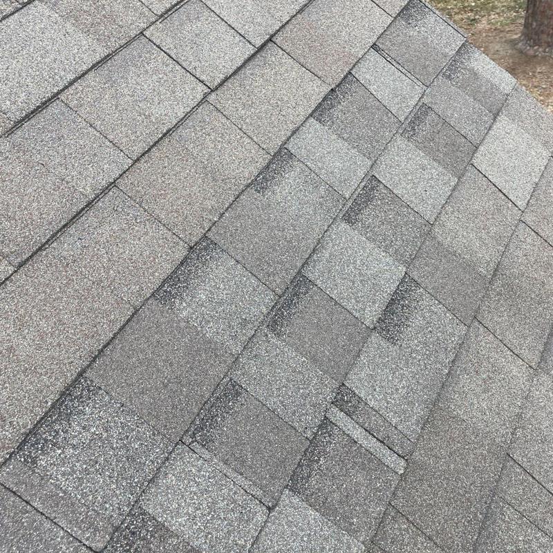 Architectural asphalt shingle roof with storm damage repair