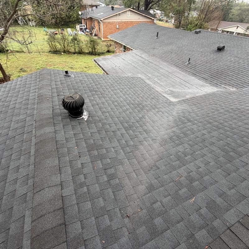 Roof shingles with ventilation pipe on residential home
