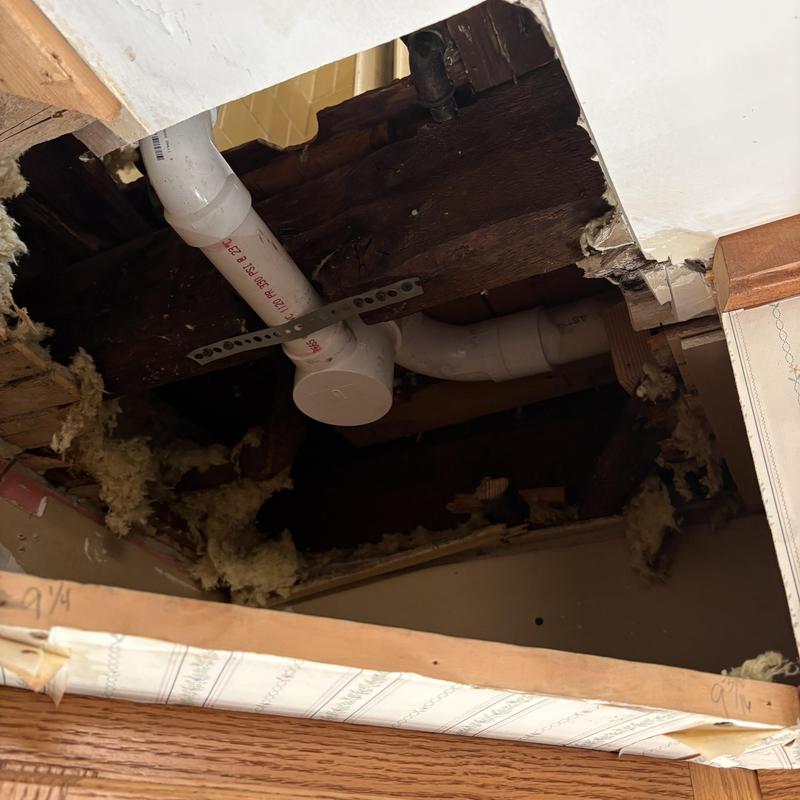 PVC tub drain and overflow pipe installation above ceiling