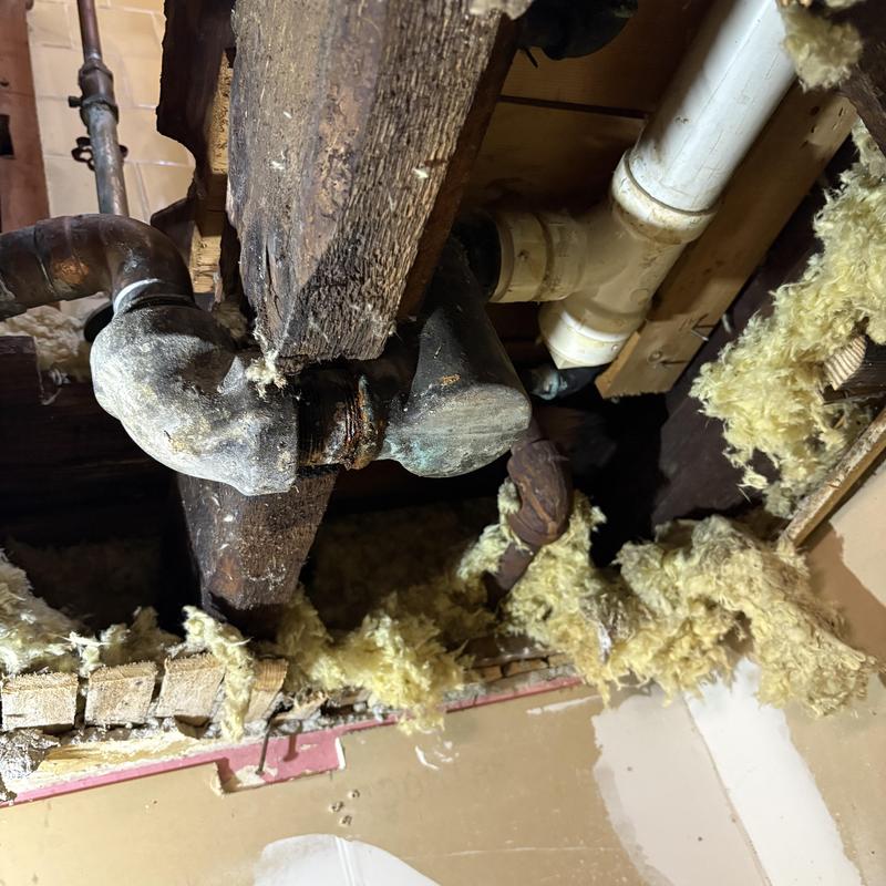 Galvanized pipe leak in ceiling with insulation removed