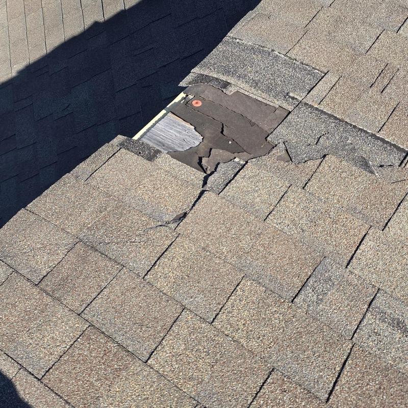 Asphalt roof shingles with hail and wind damage