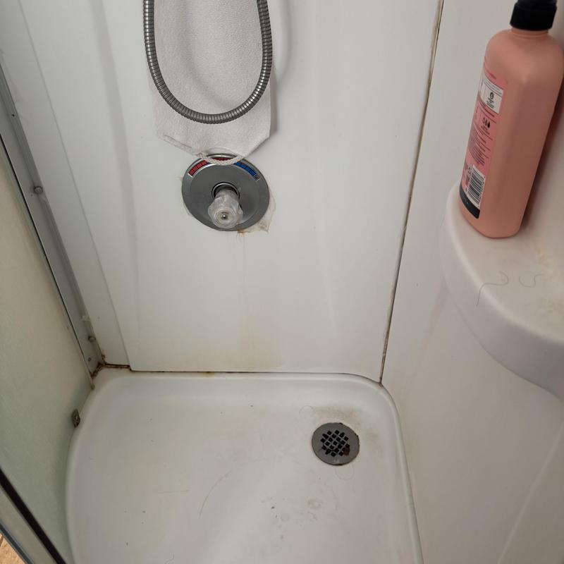 Shower valve with incorrect installation and stain marks