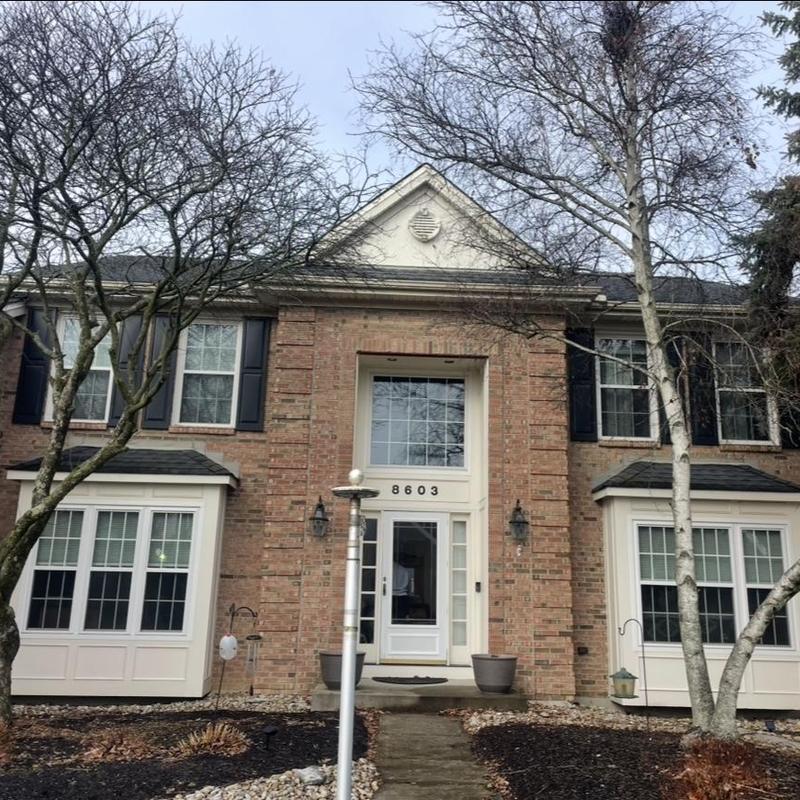 Seamless aluminum gutters with black Shur Flo guards installed