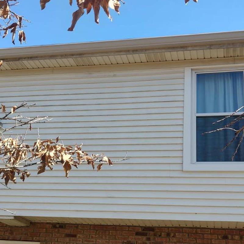 Seamless aluminum gutters with black Shur Flo guards