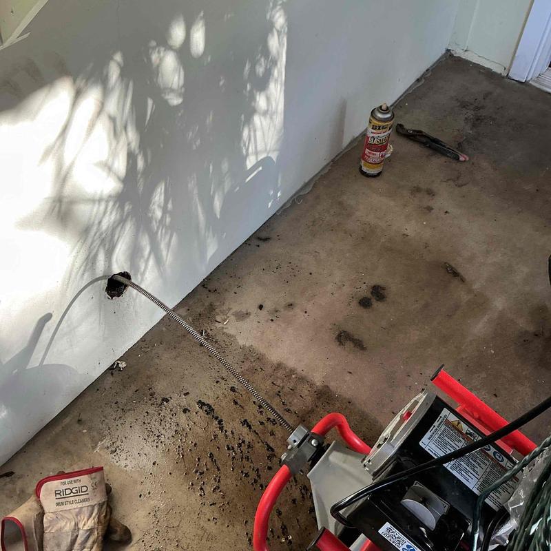 Kitchen drain line snaking with Ridgid drum machine