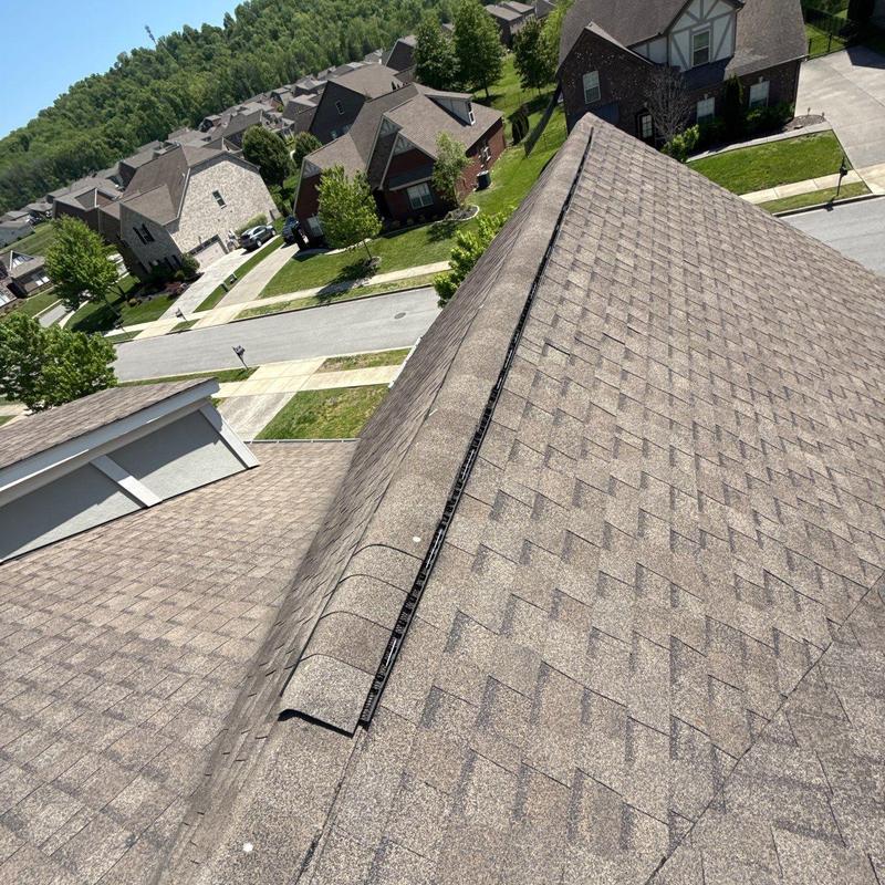 Asphalt shingle roof with ridge vent installation inspection