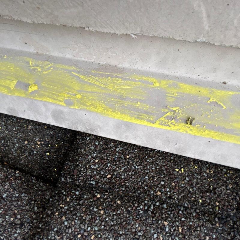 Roof shingles and ridge cap with hail damage markings