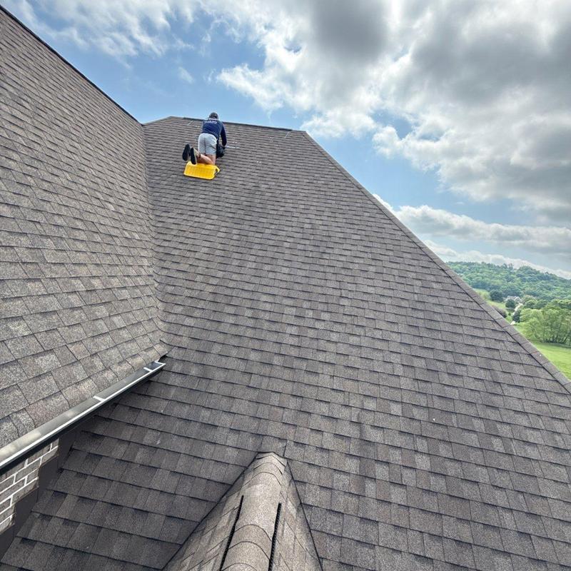 Asphalt shingle roof with hail damage inspection