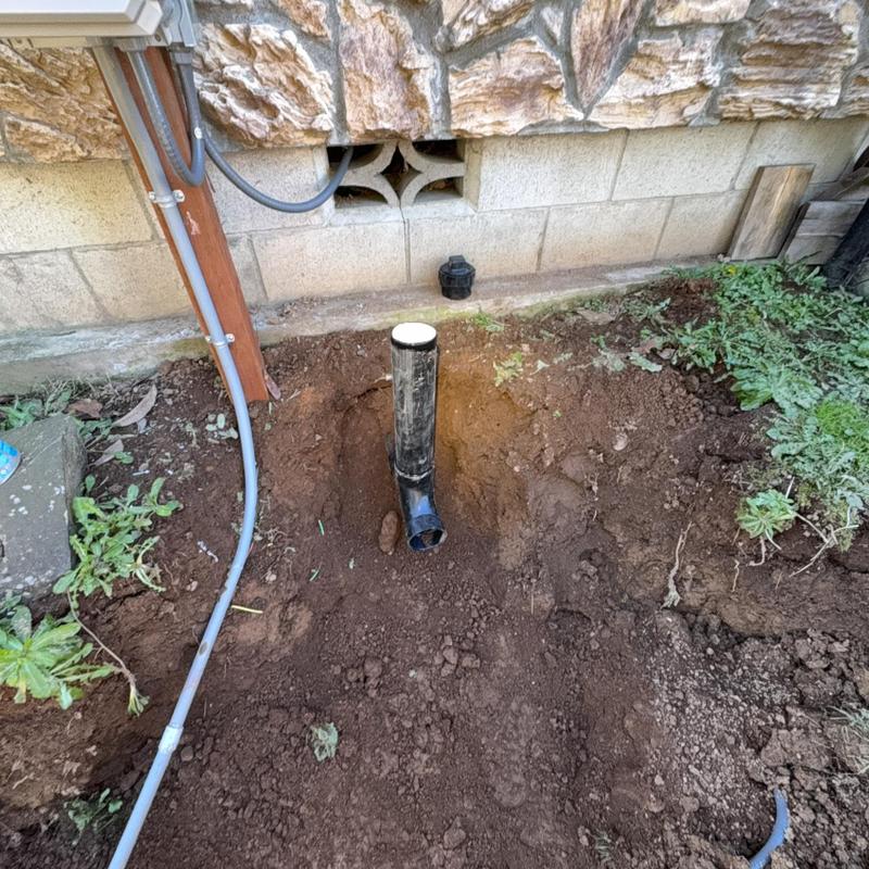 3” ABS sewer drain pipe outlet near foundation wall