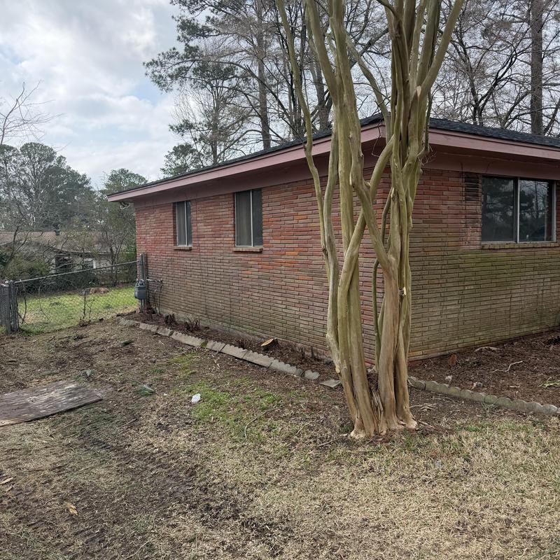 Brick exterior chemical wash before painting in Florence, MS