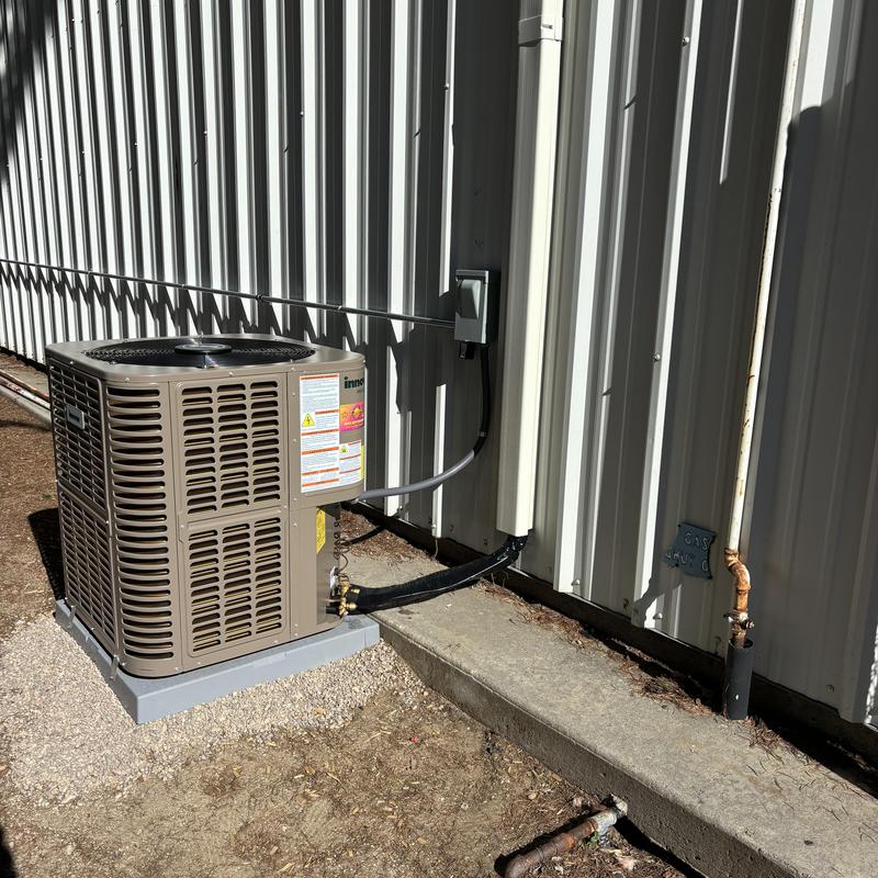 Innovair 20 SEER heat pump unit outside building Innovair 20 SEER heat pump unit outside building