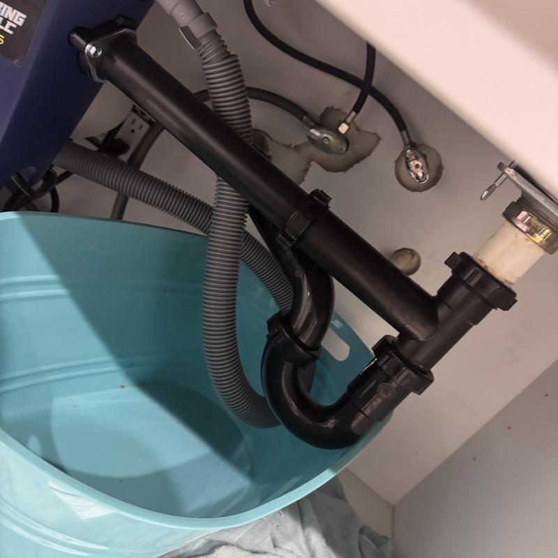 Basket strainer and drain pipes under sink
