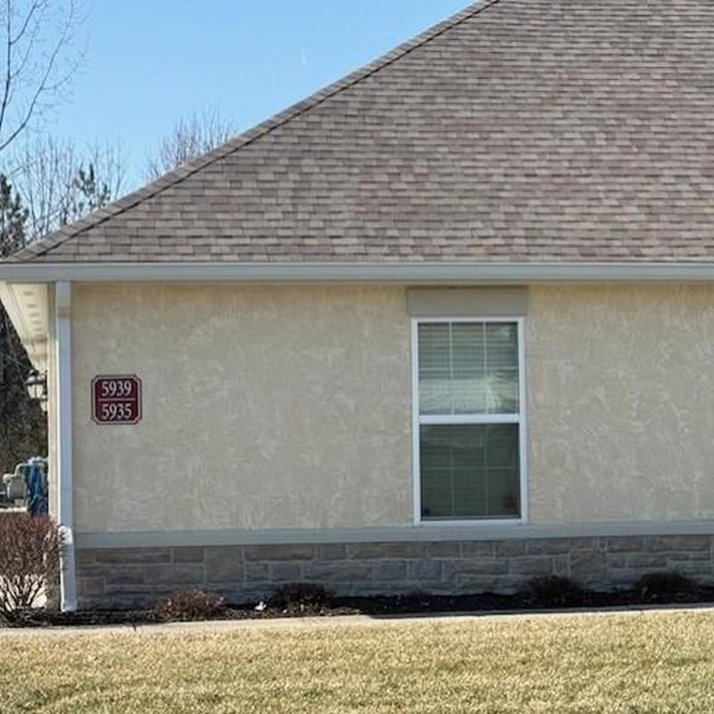 Asphalt shingle roof and exterior wall with window Asphalt shingle roof and exterior wall with window