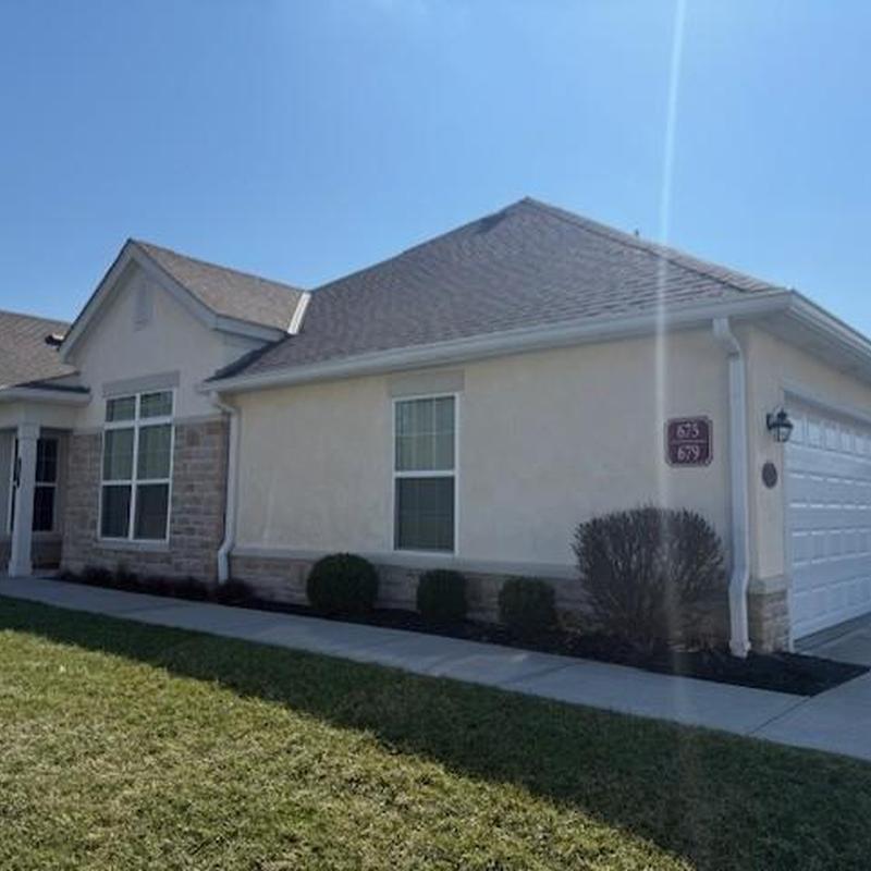 Roof shingles and gutters on residential home exterior Roof shingles and gutters on residential home exterior