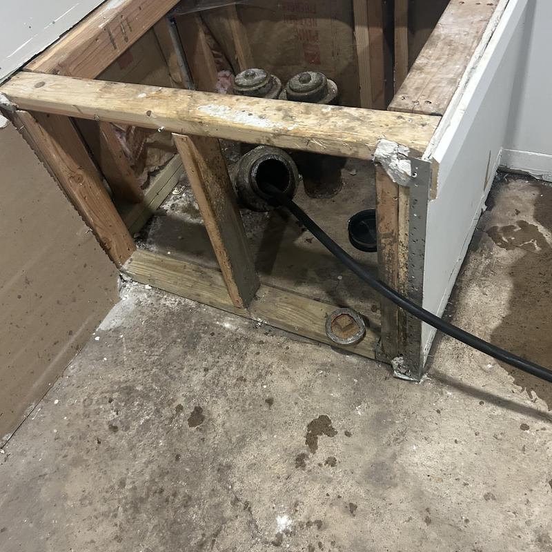 Sewer pipe jetting inside exposed floor framing Sewer pipe jetting inside exposed floor framing