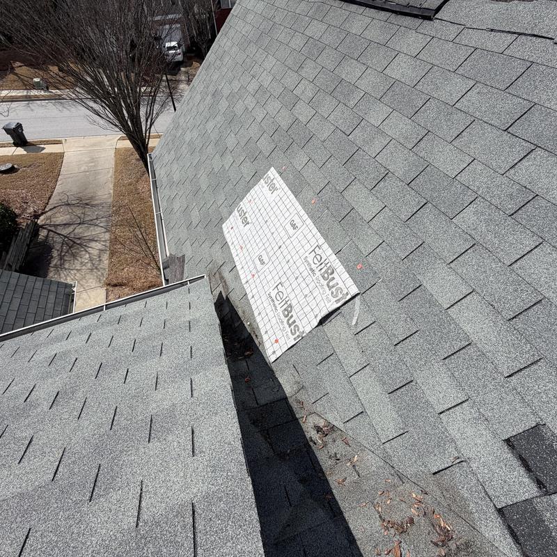 Roof valley tarp installed over missing shingles