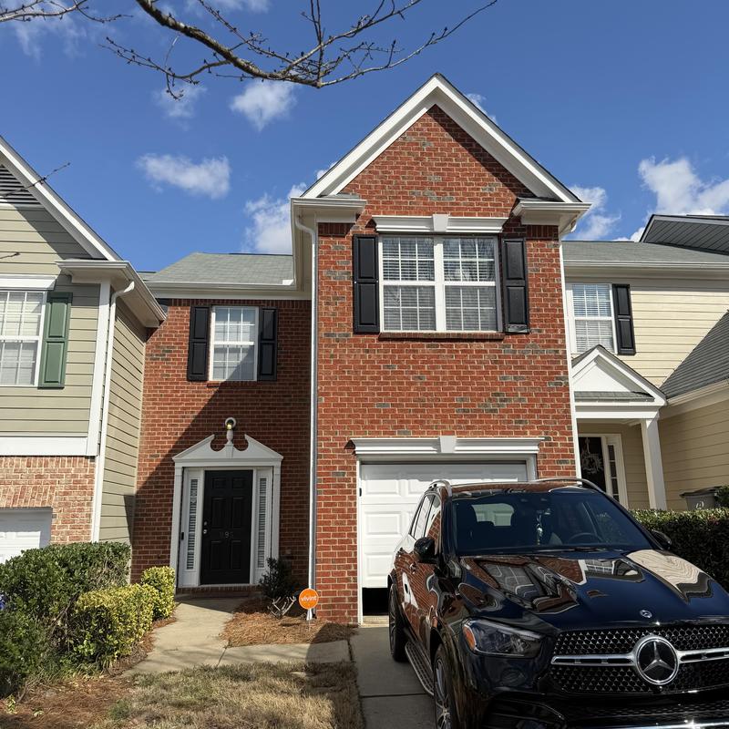 Roof valley with tarp on missing shingles