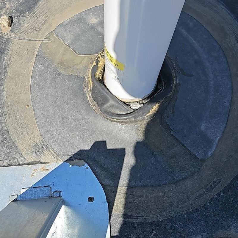 EPDM roof pipe flashing with silicone patch repair EPDM roof pipe flashing with silicone patch repair