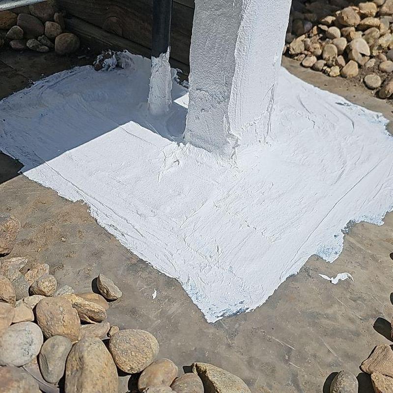 EPDM flat roof corner patched with silicone sealant EPDM flat roof corner patched with silicone sealant