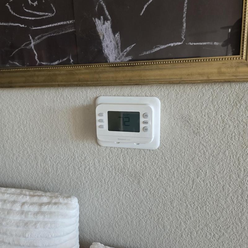 Digital wall thermostat display set to 72 degrees