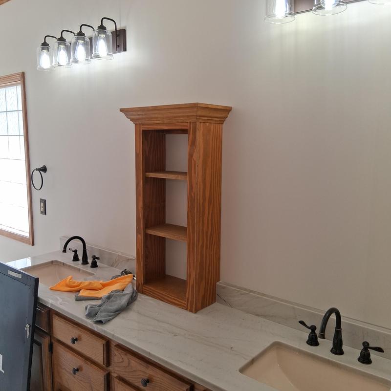 Bathroom light fixtures installation with vanity shelves
