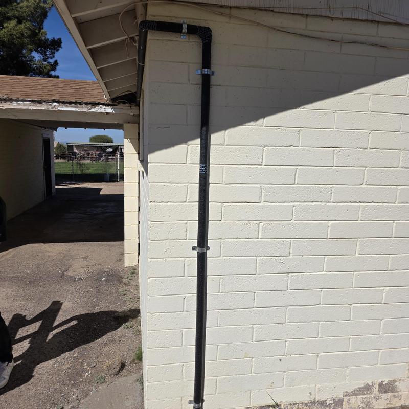 Hot water repipe line on home exterior wall