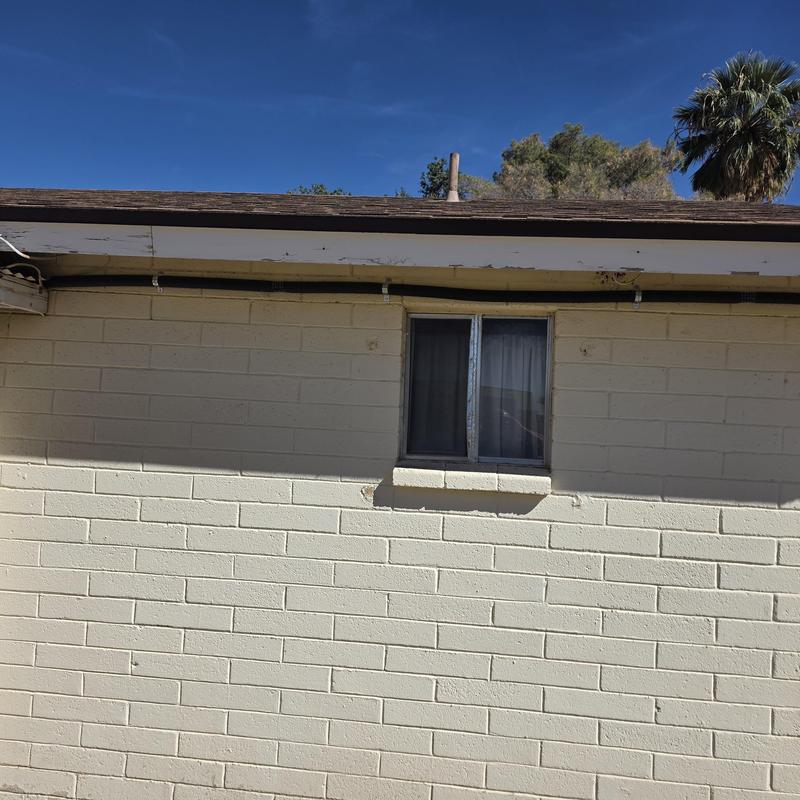 Hot water pipe exterior repiping on brick wall