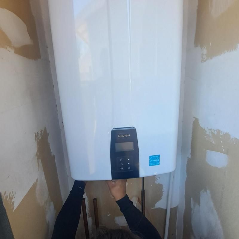 Tankless water heater installation in exterior closet