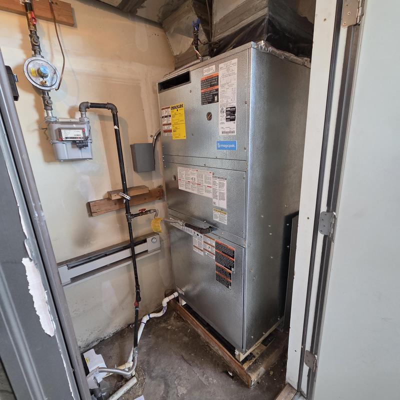 Magic-Pak HVAC unit installation in utility closet