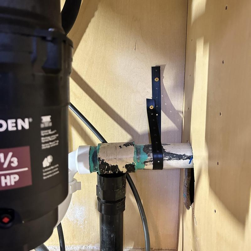 Kitchen sink drain pipe with secured strap and fittings