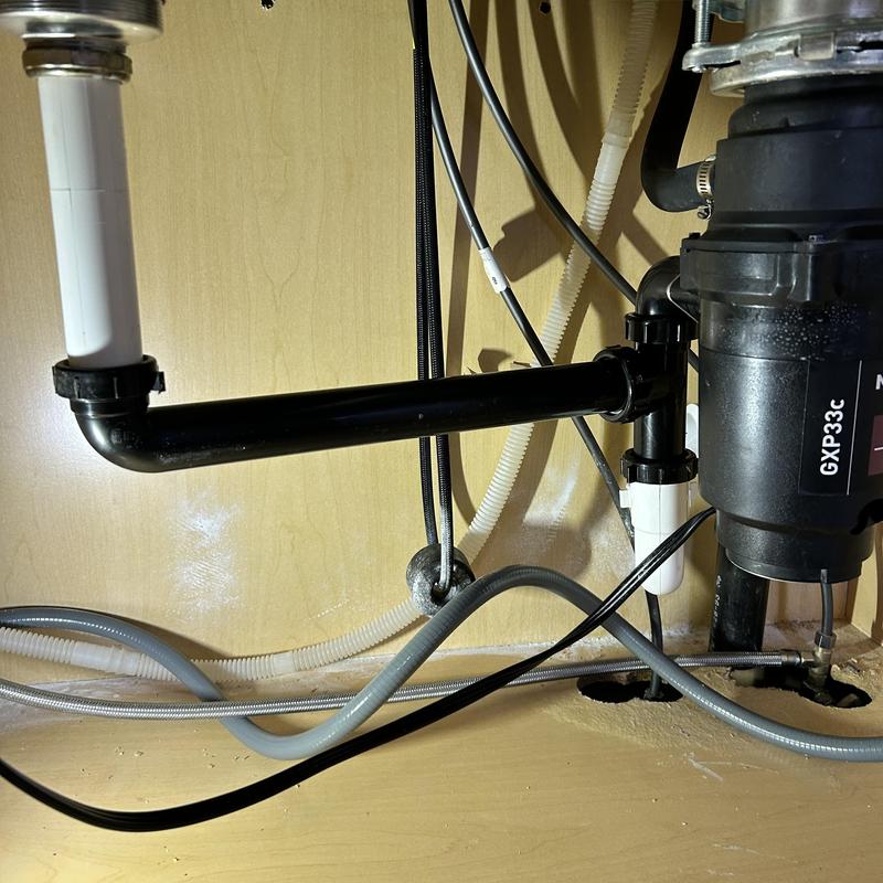 Kitchen sink drain pipe with new waste line installed