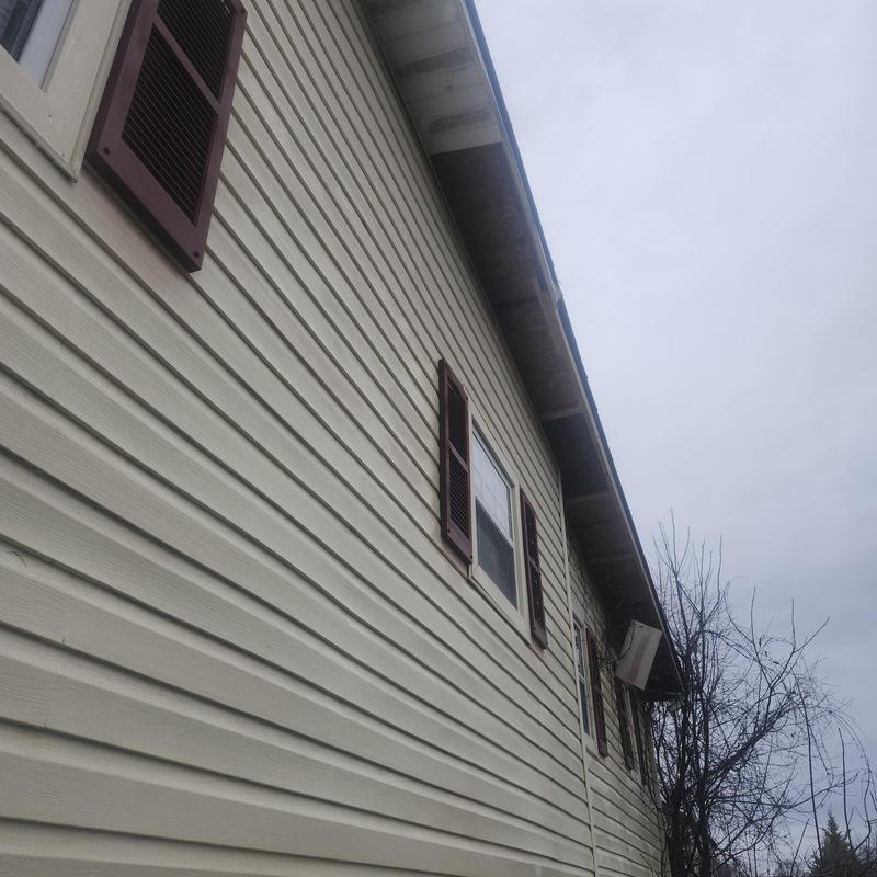 Vinyl soffit installation on residential siding exterior