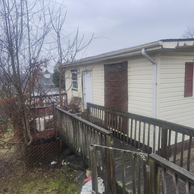 Vinyl soffit installation on house exterior wall