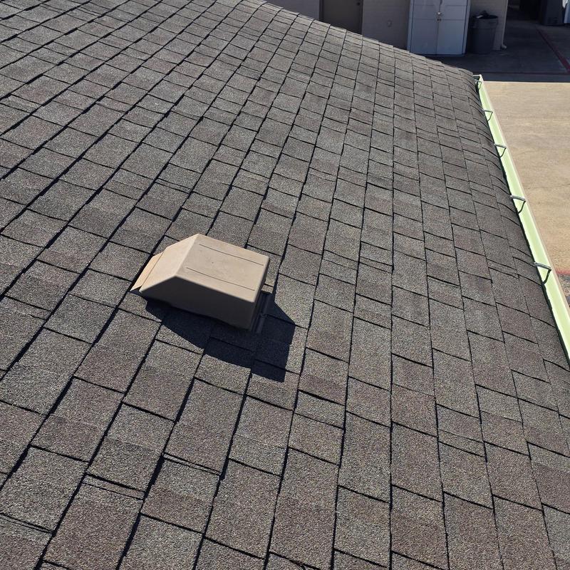 Asphalt shingle roof with vent and gutters in Terrell TX
