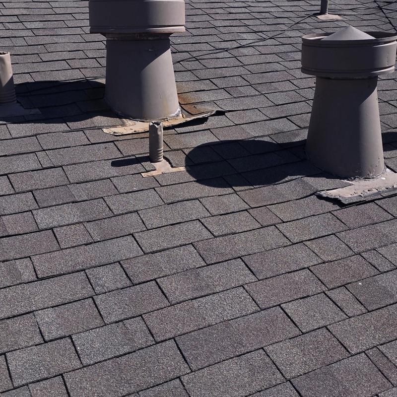 Roof vent flashing and shingle damage from storm