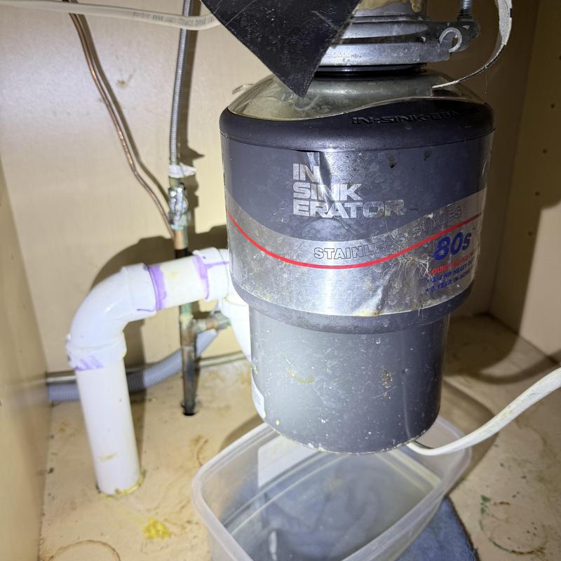 InSinkErator garbage disposal with PVC drain piping