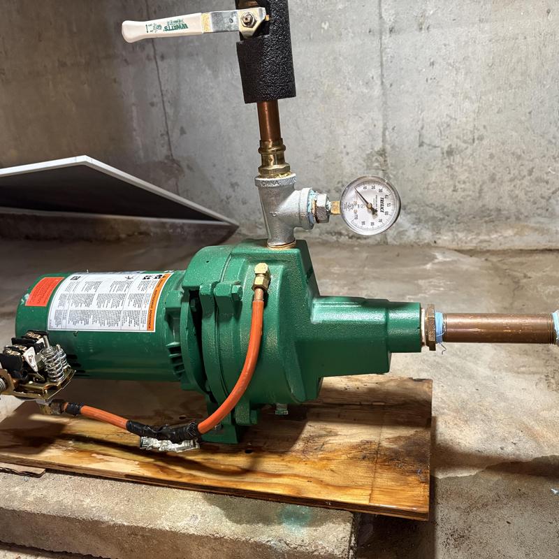 Well pump system with pressure gauge and copper piping