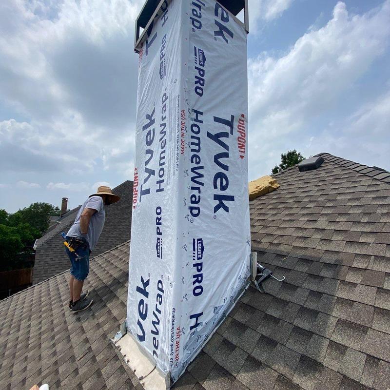 Chimney chase with Tyvek HomeWrap on roof Chimney chase with Tyvek HomeWrap on roof