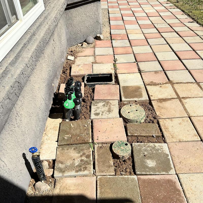 Irrigation valves and hose bib installation with pavers
