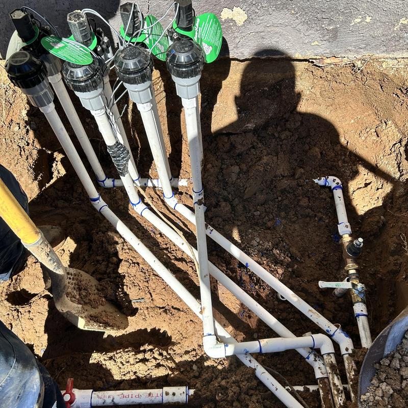 Irrigation system PVC piping and valves installation in yard