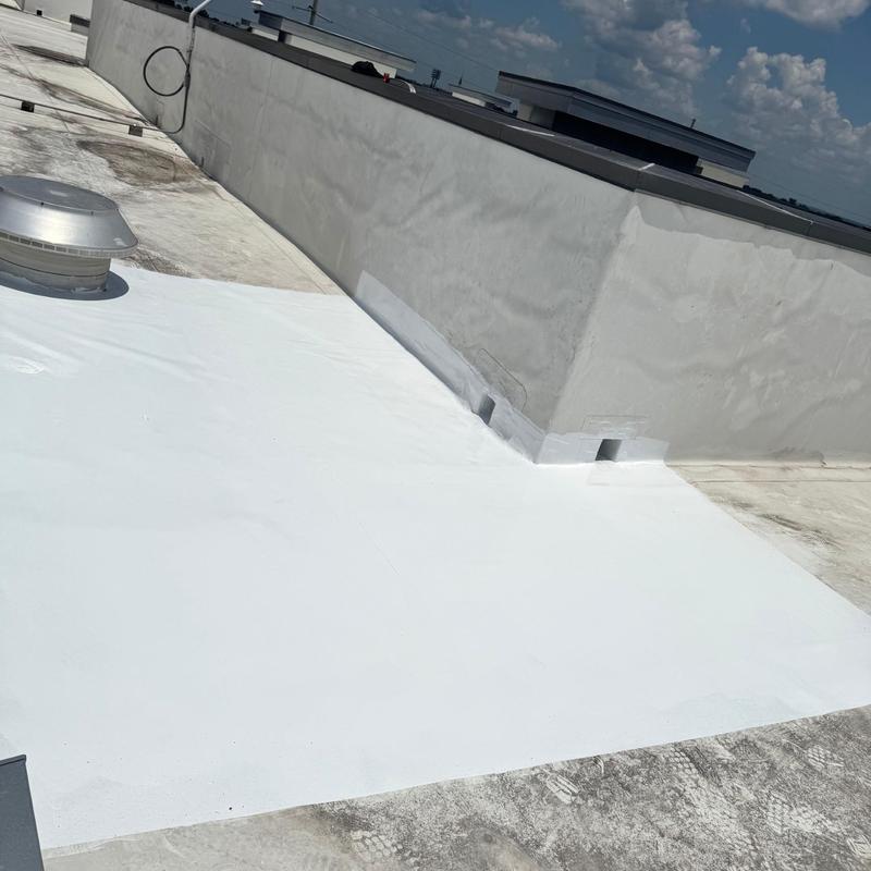 Flat roof membrane patch and seal on apartment building