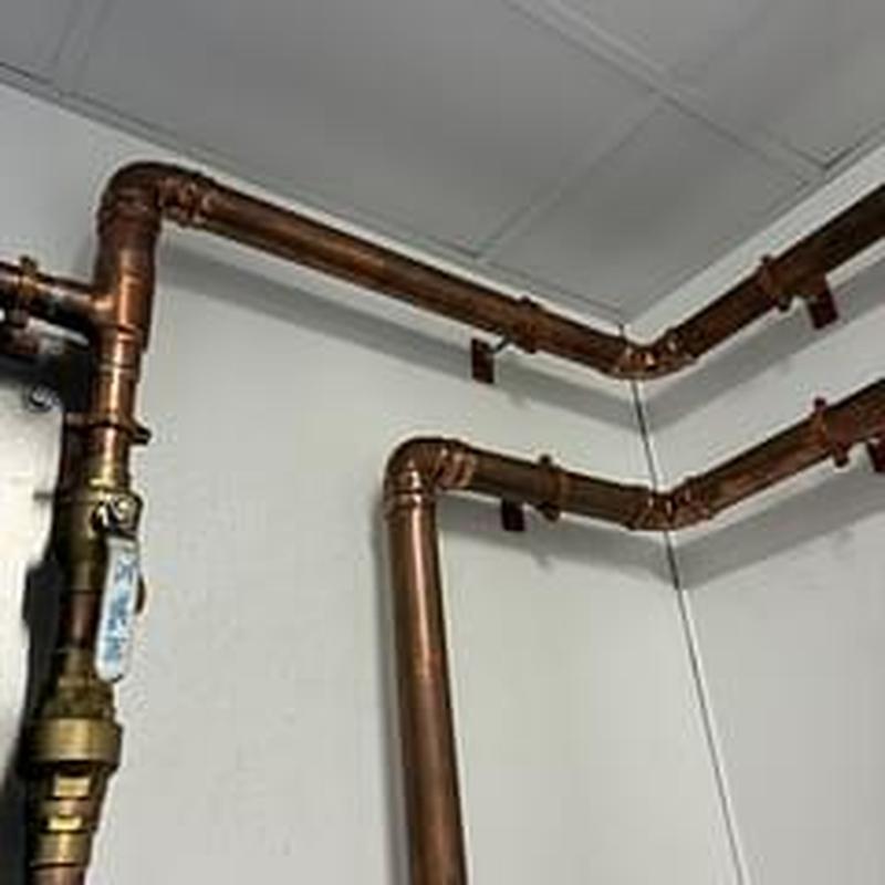 Copper pipes with insulation installed on wall
