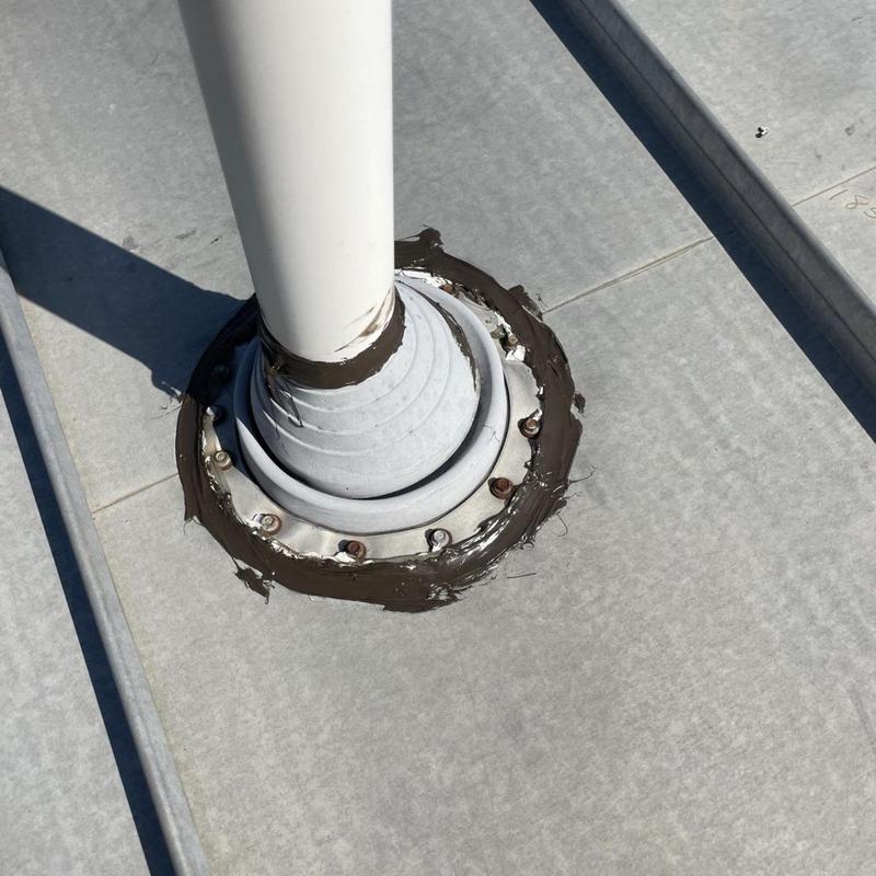 Metal roof pipe boot with fresh sealant application