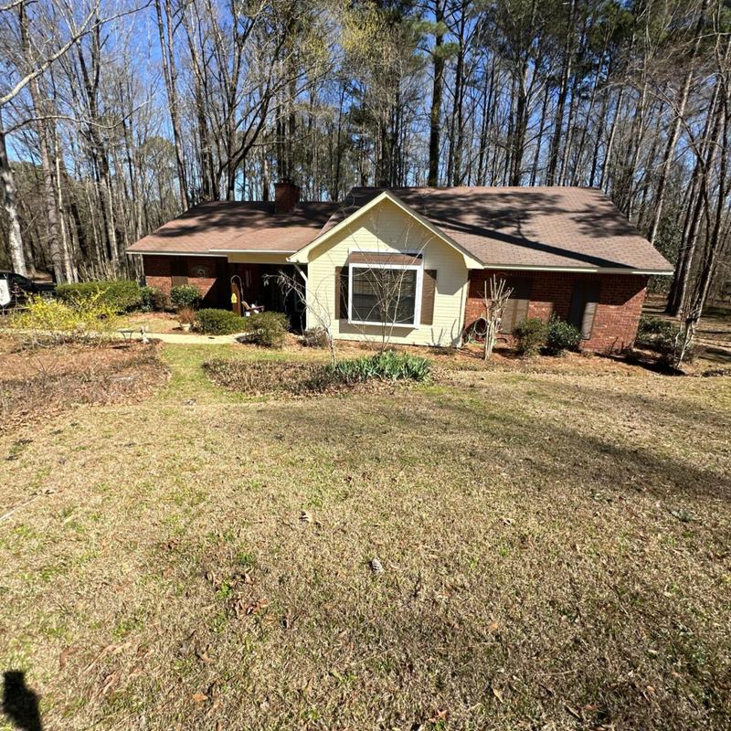 Asphalt shingle roof on residential home with yard