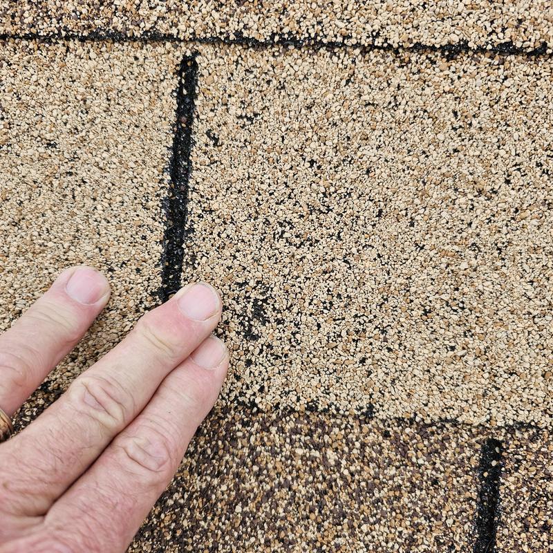 Asphalt roof shingle granule loss from hail damage