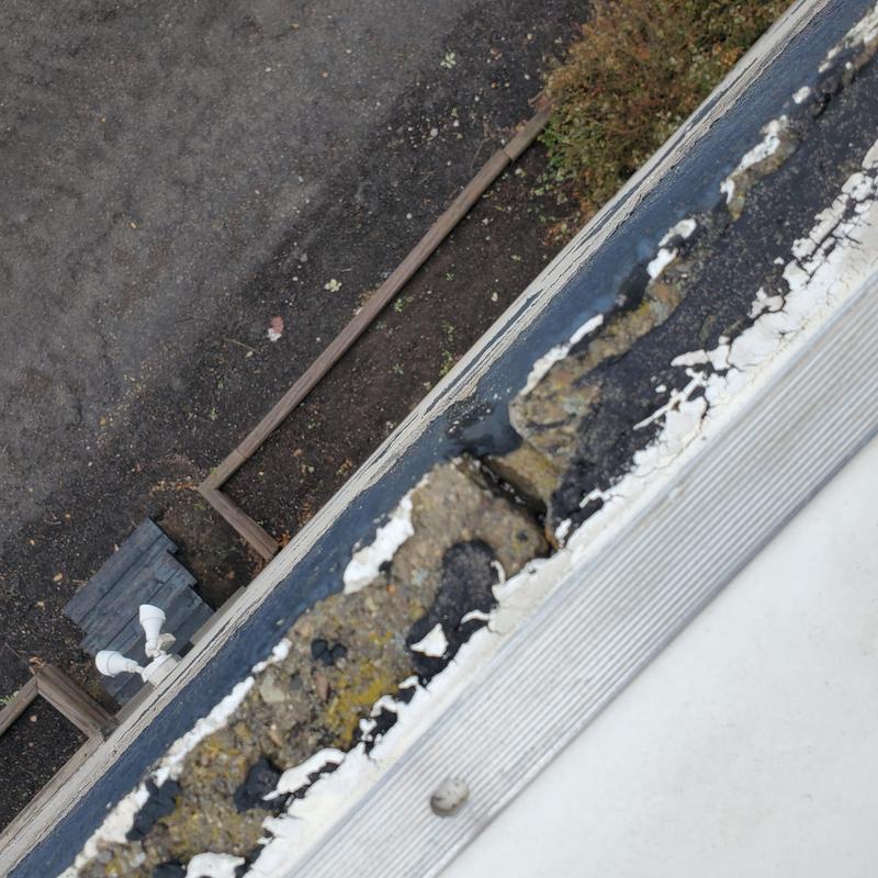 Roof edge and damaged sealant from hail exposure